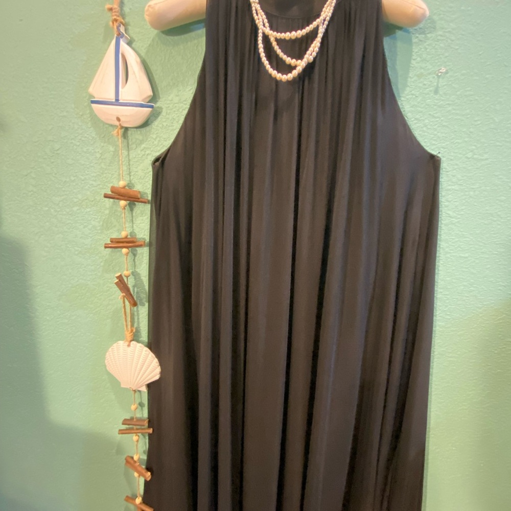 Fresh black fabric dress with bow and ribbons on neck for a bow